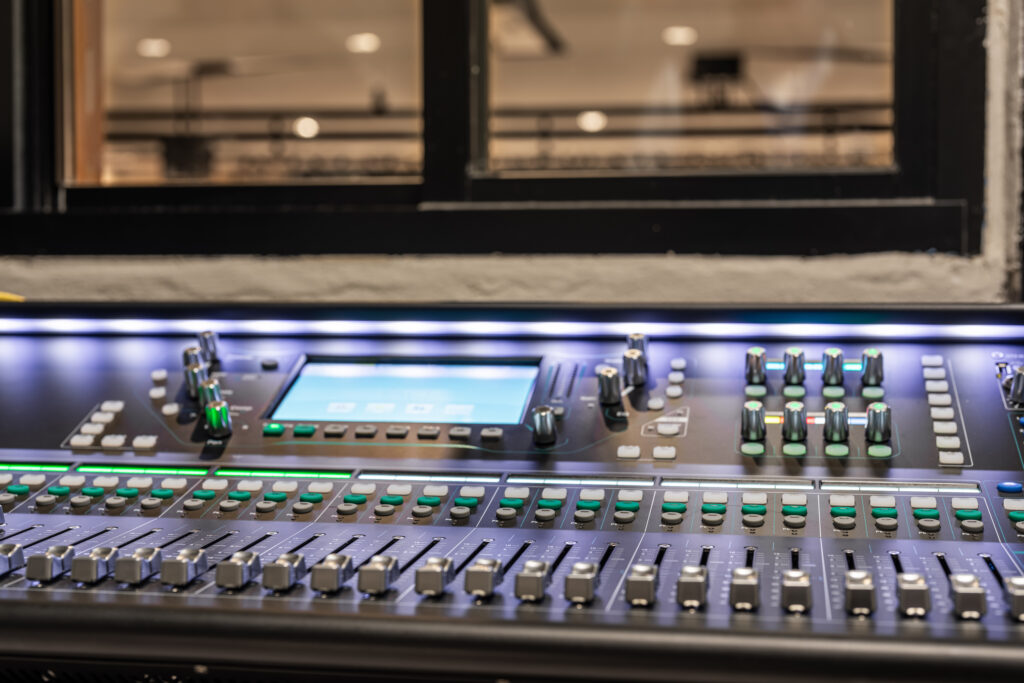 mixing console, sound board, equipment in an auditorium, theater sound / projection booth.