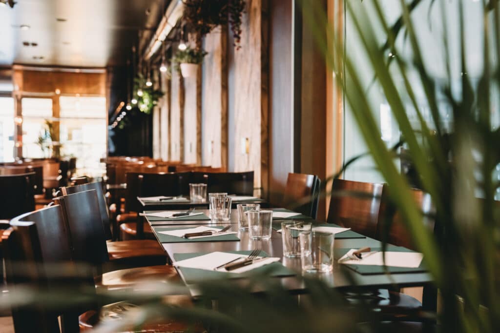 empty tables awaiting customers in a modern restaurant with music service
